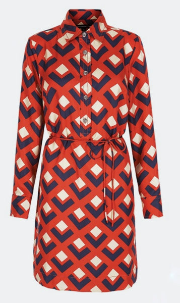 Full front view: a mannequin displaying a Banana Republic Madmen Collection silk red and navy geometric print shirt shift dress with a 5 button front bodice closure and matching string belt.