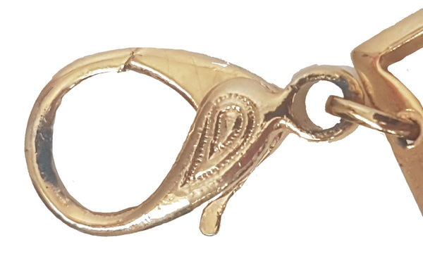 Close-up of surface wear and plating loss along the inside edge of the gold-tone lobster clasp