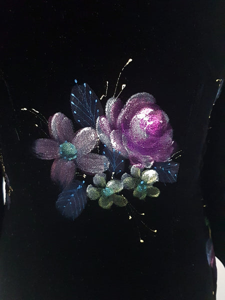 Fabric and hand-painted pink floral design closeup view on a 1950s black velvet cheongsam qipao dress