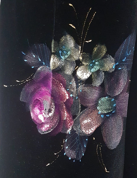 Fabric and hand-painted pink floral design closeup view on a 1950s black velvet cheongsam qipao dress