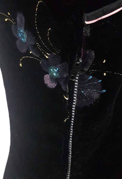 Zipper view of a 1950s black velvet cheongsam qipao dress with a hand-painted pink floral design 