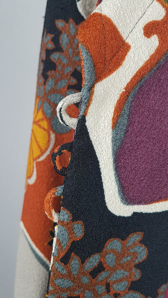 Button loops on Vintage Y2K cropped jacket featuring three-quarter sleeves and an abstract floral print in plum, rust, cream, black and grey