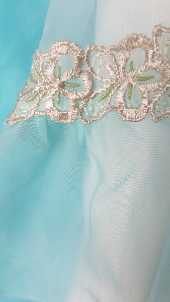 Sleeve details on Vintage 1960's Canadian Maid Azure Blue Gathered Yoke Robe with silver and white decorative details on bust and sheer sleeves displayed on a mannequin