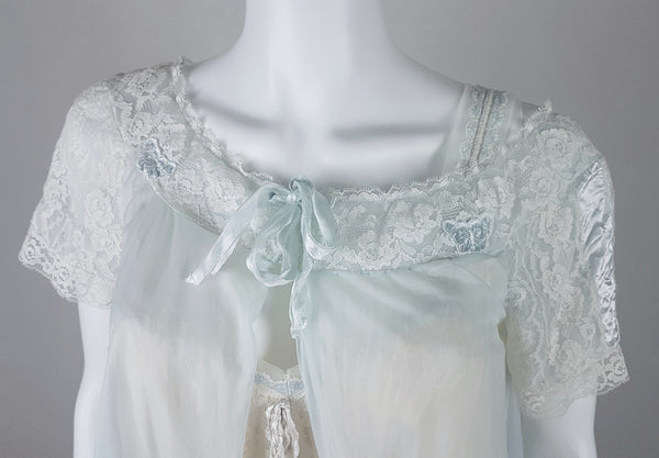 Torso details of Vintage 1960s Aristocraft by Superior pastel blue peignoir with cream floral lace and ribbon ties displayed on a mannequin - front view