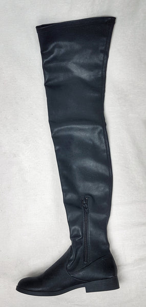 Black vegan leather over-the-knee boots with a smooth texture and a slight sheen, featuring a partial side zip closure and an almond-shaped toe - flatlay, side view