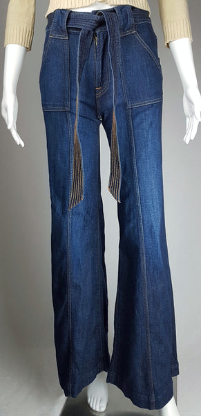 Full front view of deadstock 7 For All Mankind indigo palazzo jeans with a knotted denim belt, large patch pockets and wide legs displayed on a mannequin