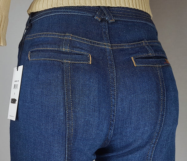 Close-up of the rear waistband, shaped seams and two welt pockets on 7 For All Mankind indigo jeans