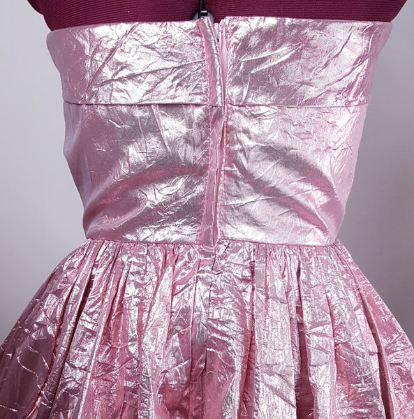 Back close-up of strapless bodice with diagonal ruching and fitted waist