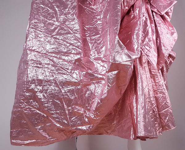 Close-up of voluminous gathered skirt and asymmetrical bustle-style detail