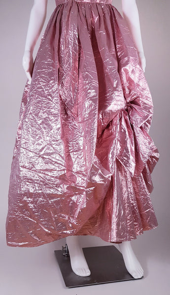 Front view of full metallic pink skirt with picked-up draping and ruffled hem
