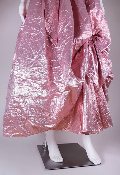 Front view of full metallic pink skirt with picked-up draping and ruffled hem
