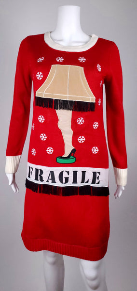 Front view of the red Christmas sweater dress showing the leg lamp, embroidered snowflakes and cream ribbed trim