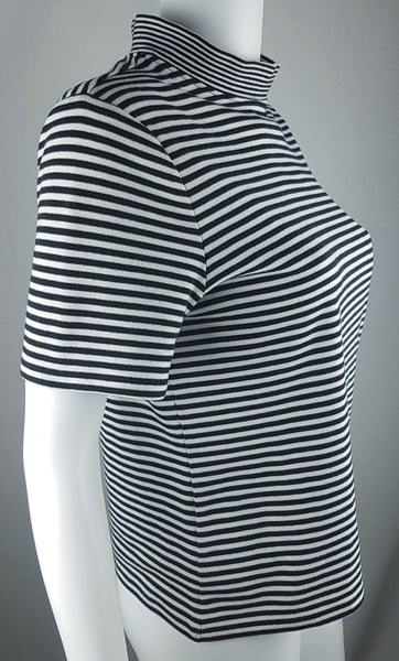 Full three quarter view of an Alia black and white striped knit top with short sleeves, a mock neckline and a softly fitted silhouette.