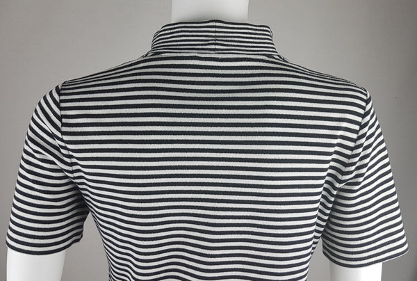 Closer back view of an Alia striped mock-neck top showing its softly shaped waist and short sleeves.