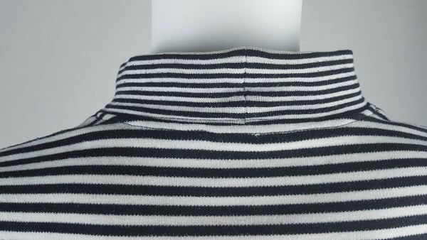 Close-up of the back mock neckline and horizontal black and white stripes on an Alia knit top.