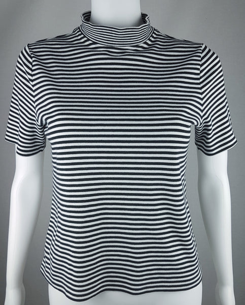 Full front view of an Alia black and white striped knit top with short sleeves, a mock neckline and a softly fitted silhouette.