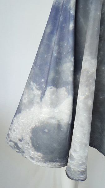 Detailed side view of the cratered moon-surface print and softly curved hem of a BG Design Canada Moon Print Circle Skirt from Fall 2016 Collection 