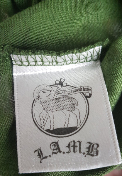 Brand label for Green and black patterned “LOVE” T-shirt top from Gwen Stefani’s Fall 2005 L.A.M.B. collection, with an ornate black chest motif.