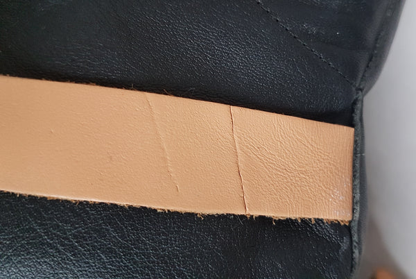 Close up of tan strap to show abrasion and condition on one strap