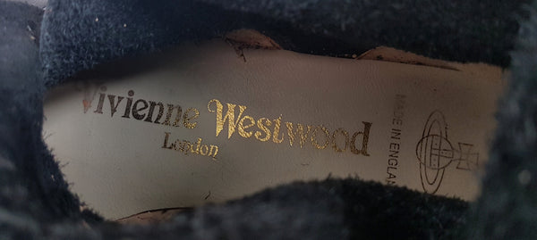 Inner boot replica label view of black mid-calf leather boots 