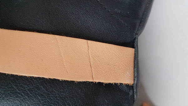 Close up of tan strap to show abrasion and condition on one strap