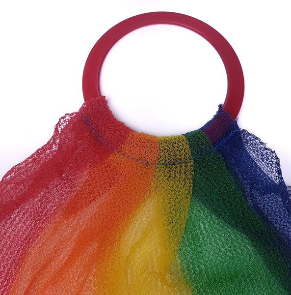 Close-up of the round red handles on a Multicoloured Plastic Mesh Tote Bag 