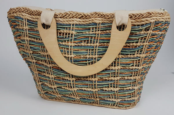 Side view of wooden handle attached through a cream woven tab at the top of the bag
