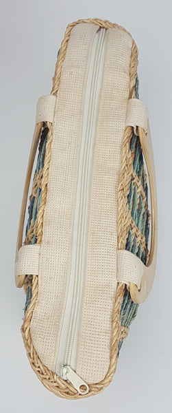 Overhead view showing the cream zip-top closure between the two wooden handles