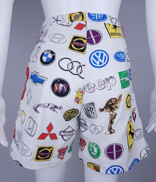 Full back view of the wide-leg shorts showing the multicoloured automotive print