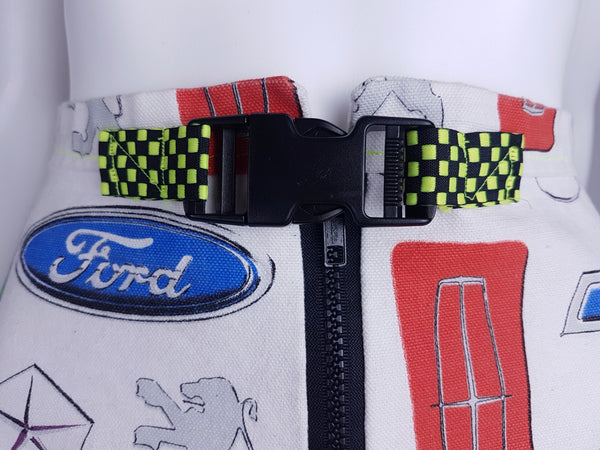 Close-up of the black side-release buckle and yellow-and-black checkerboard webbing belt