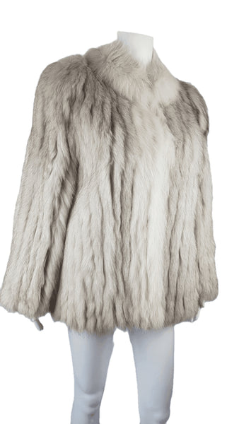 Saga Fox Pale blue fox fur jacket with long sleeves, a plush collar, and natural silver grey markings on a mannequin