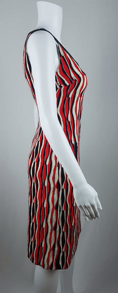 side view of a modern Tocca red, black and ivory Op Art woven sheath dress with black V-neck trim displayed on a mannequin