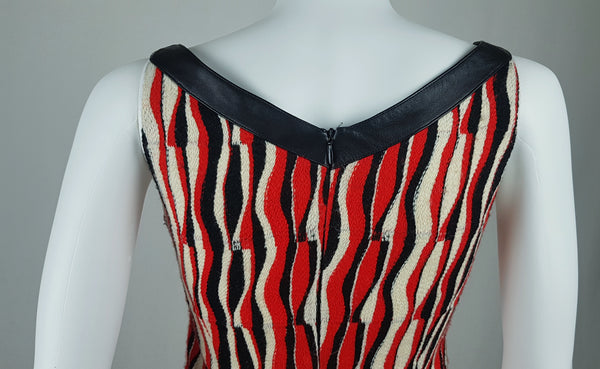 Close-up back view of a modern Tocca woven dress, showing the black-trimmed neckline and centre-back zipper.
