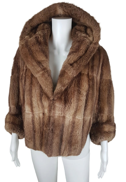Full front view of a vintage 1950s Hudson’s Bay Company warm light-brown mink stole jacket with a shawl collar and three-quarter sleeves.