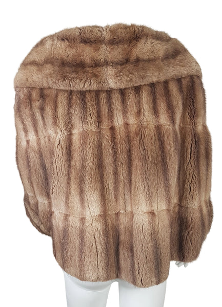 Full back view of a vintage 1950s Hudson’s Bay Company warm light-brown mink stole jacket with a shawl collar and three-quarter sleeves.