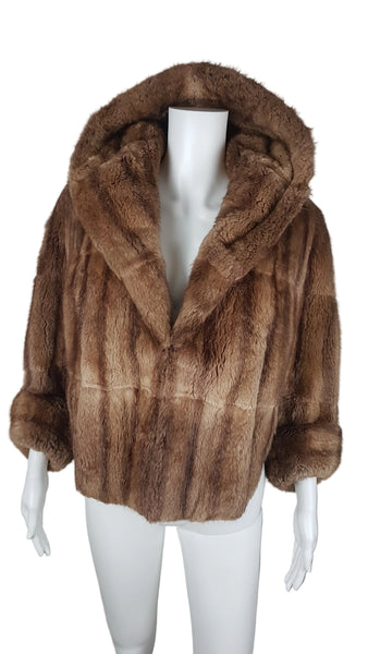 Full front view of a vintage 1950s Hudson’s Bay Company warm light-brown mink stole jacket with a shawl collar and three-quarter sleeves.