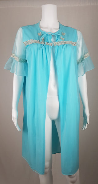 Vintage 1960's Canadian Maid Azure Blue Gathered Yoke Robe with silver and white decorative details on bust and sheer sleeves displayed on a mannequin - front view
