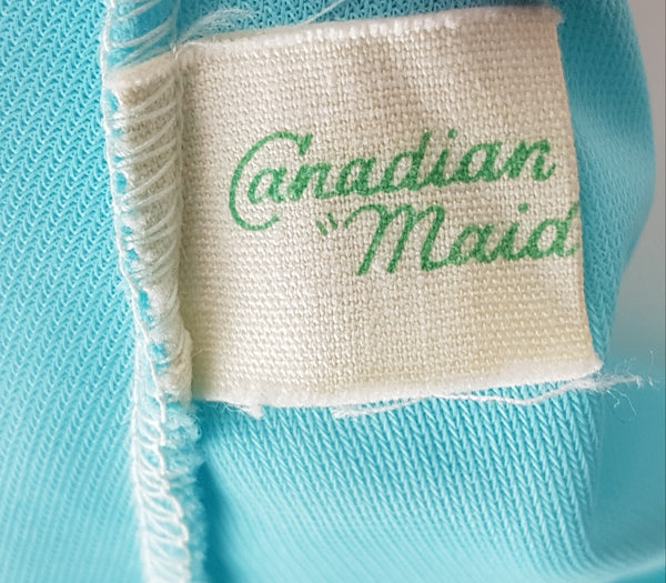 Label of Canadian Maid Vintage 1960's Azure Blue Gathered Yoke Robe with silver and white decorative details on bust and sheer sleeves displayed on a mannequin