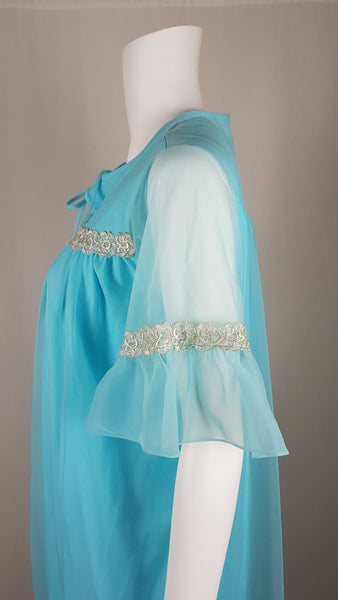 Vintage 1960's Canadian Maid Azure Blue Gathered Yoke Robe with silver and white decorative details on bust and sheer sleeves displayed on a mannequin - side view