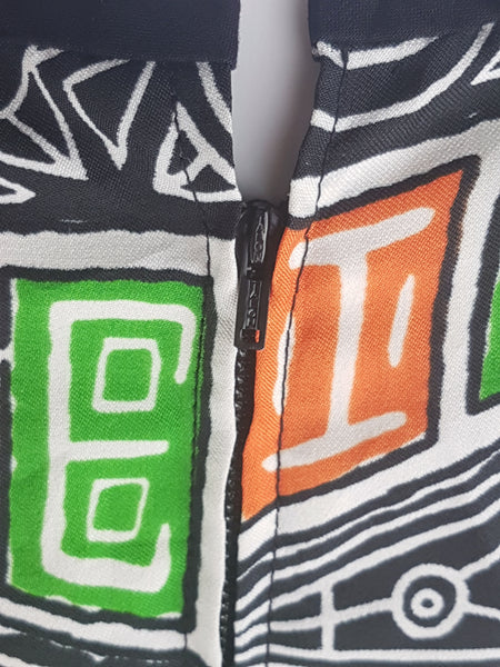 Close-up of the back zipper on a 1960s zodiac dress.