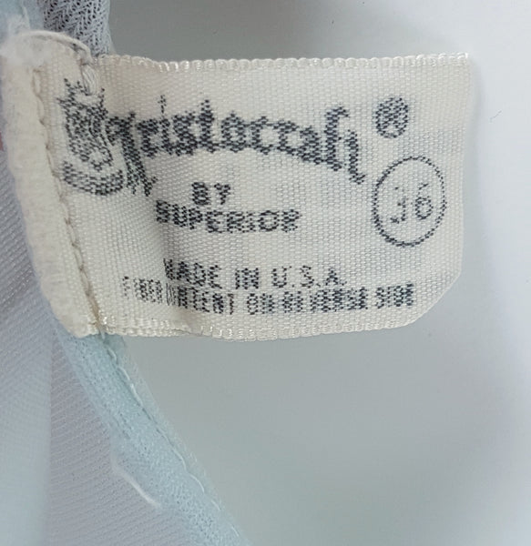 Vintage 1960s Aristocraft by Superior pastel blue peignoir and nightgown set with cream floral lace and ribbon ties displayed on a mannequin - label and vintage sizing details