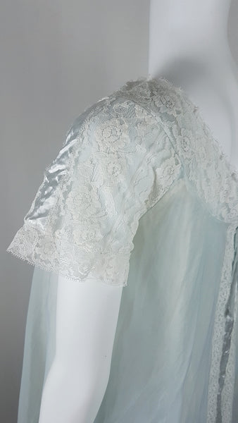 Vintage 1960s Aristocraft by Superior pastel blue peignoir and nightgown set with cream floral lace and ribbon ties displayed on a mannequin - sleeve view
