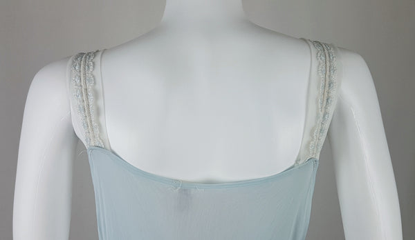 Vintage 1960s Aristocraft by Superior pastel blue nightgown with cream floral lace and ribbon ties displayed on a mannequin - back torso view