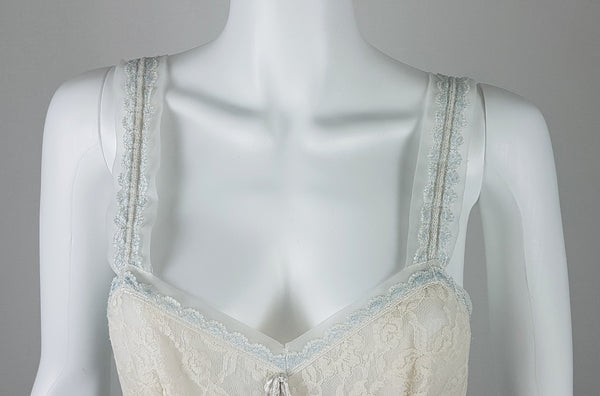 Vintage 1960s Aristocraft by Superior pastel blue nightgown with cream floral lace and ribbon ties displayed on a mannequin - bust view