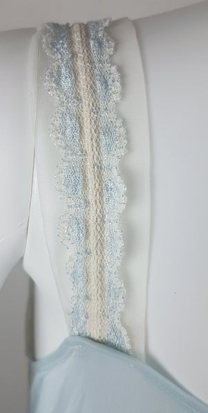 Vintage 1960s Aristocraft by Superior pastel blue nightgown with cream floral lace and ribbon ties displayed on a mannequin - lace and ribbon straps closeup view