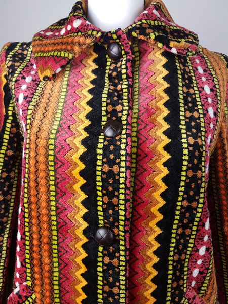 Full front close up view of a vintage 1960s Trego’s Westwear chenille coat with a fully buttoned funnel collar, displayed on a mannequin 