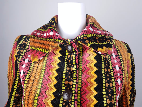 Full front close up view of a vintage 1960s Trego’s Westwear chenille coat with a fully buttoned funnel collar, displayed on a mannequin 