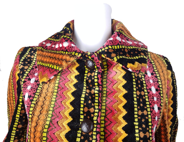 Full front shoulder and collar close up view of a vintage 1960s Trego’s Westwear chenille coat with a fully buttoned funnel collar, displayed on a mannequin 