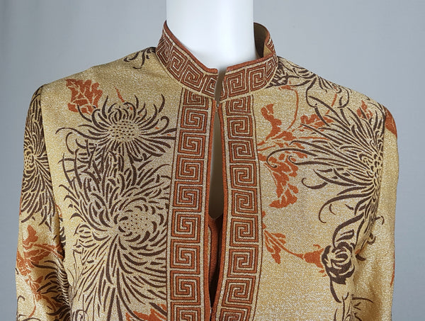 Close up view of the vintage gold floral jacket fastened over the matching maxi dress in the vintage 1970s Alfred Shaheen Gold Metallic Floral Maxi Dress & Jacket Set 