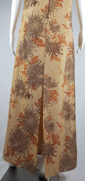 Lower front view of the chrysanthemum print maxi dress in the 1970s Alfred Shaheen Gold Metallic Floral Maxi Dress & Jacket Set 
